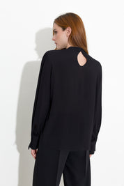 Blusa con pieghe e maniche blusanti