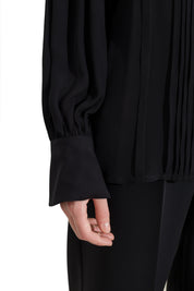 Blusa con pieghe e maniche blusanti