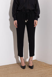 Pantalone con coulisse in fluido diagonale