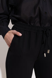 Pantalone con coulisse in fluido diagonale
