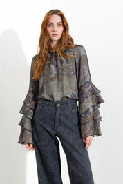 Blusa con maniche volant
