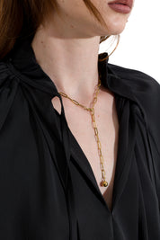Blusa satinata con laccetti e volant