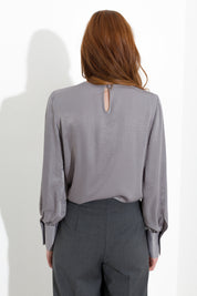 Blusa satinata con rouches