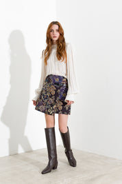 Blusa con pieghe e maniche blusanti