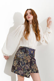 Blusa con pieghe e maniche blusanti