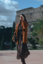 Woven coat with fringes