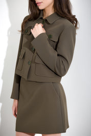 Giacca cropped in fluido diagonale