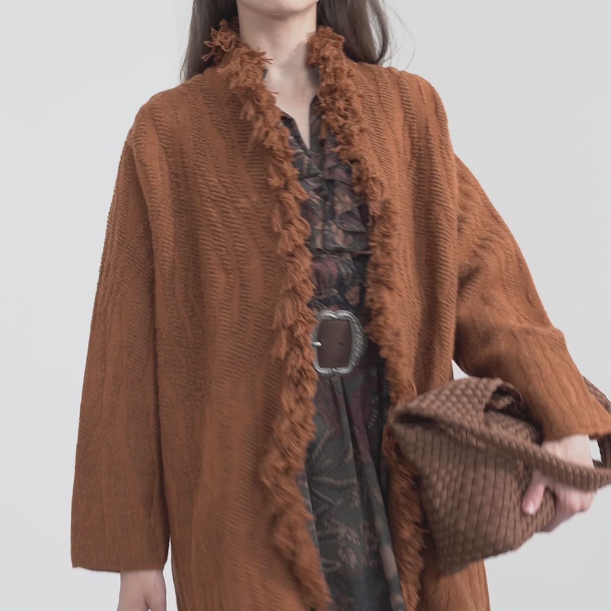 Woven coat with fringes