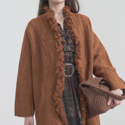 Woven coat with fringes
