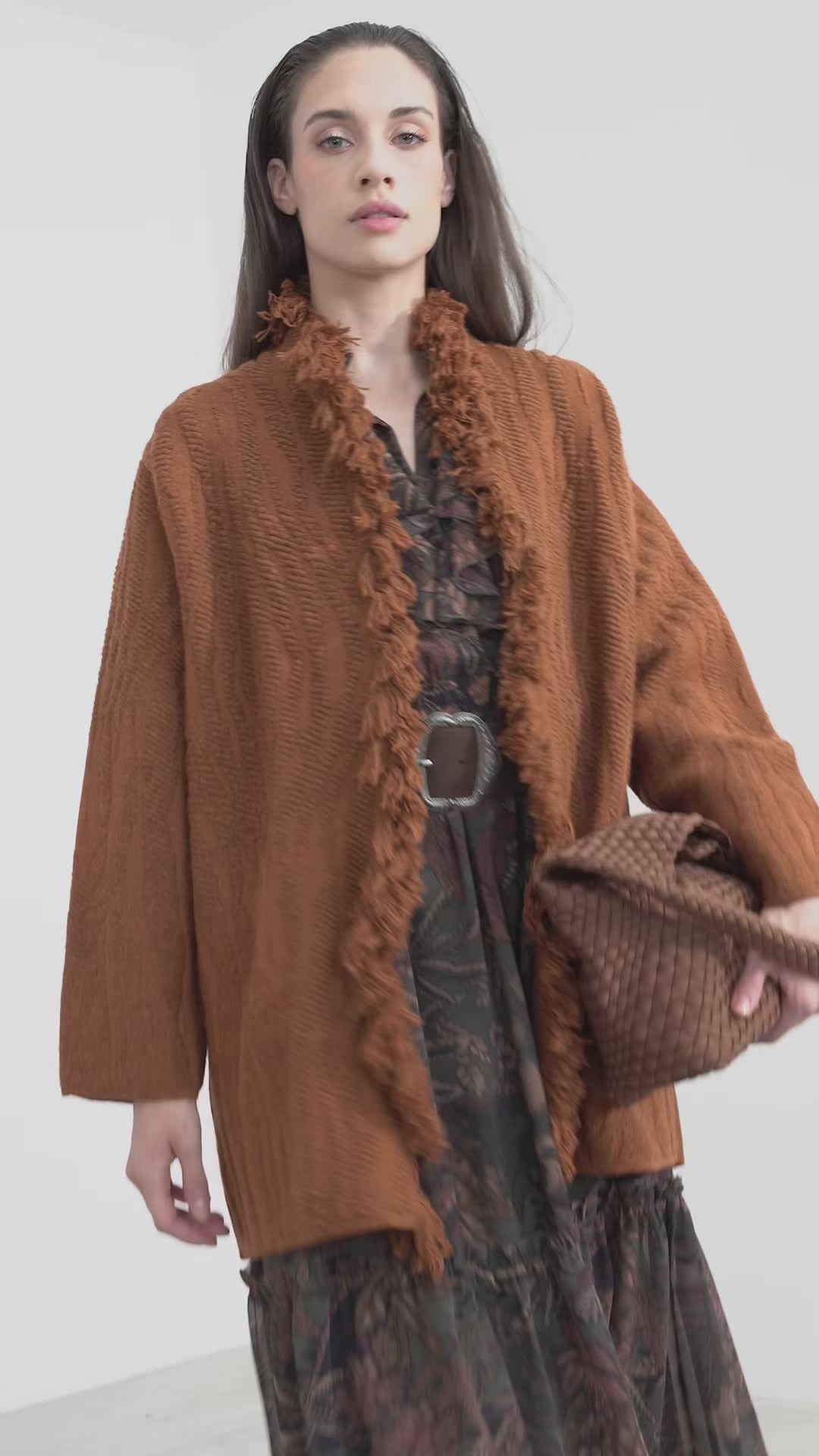 Woven coat with fringes